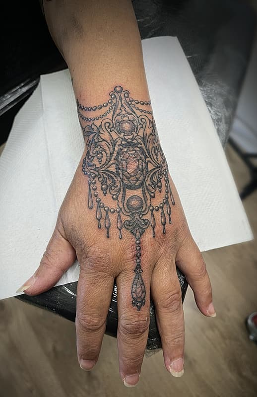 Illustrative tattoo by TBL Tattooer