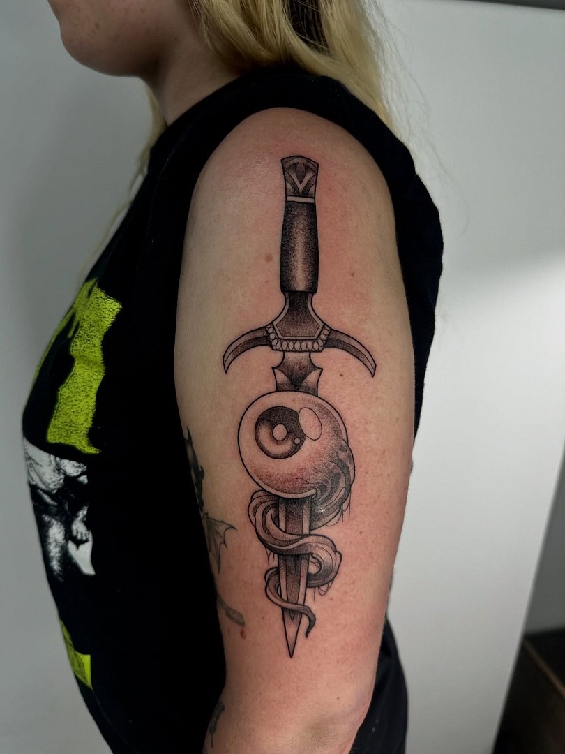 Realism (black & grey) tattoo by Danny