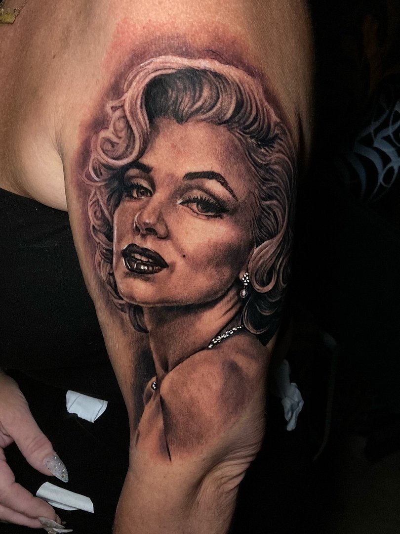 Realism (black & grey) tattoo by Trigger